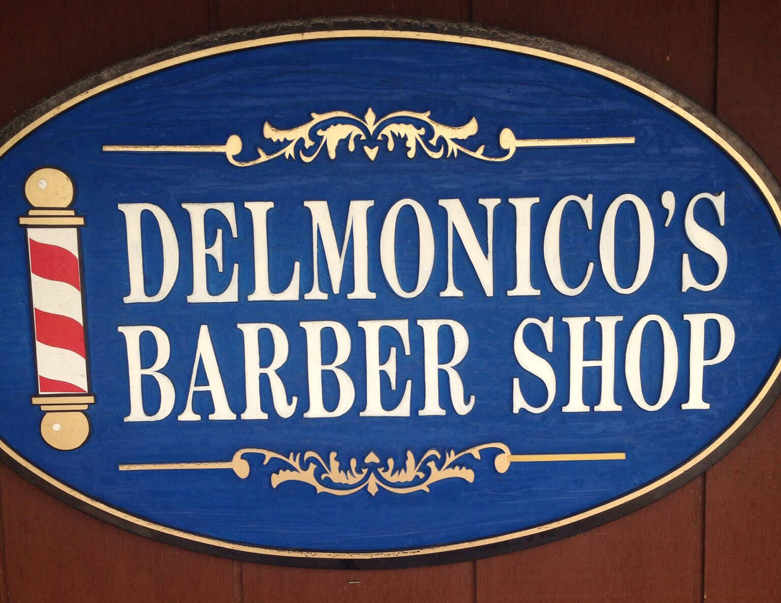 DelMonico's Barber Shop logo