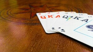 6 playing cards on a table